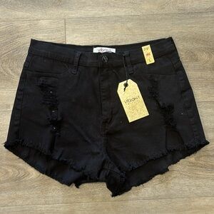 Vibrant black distressed denim shorts